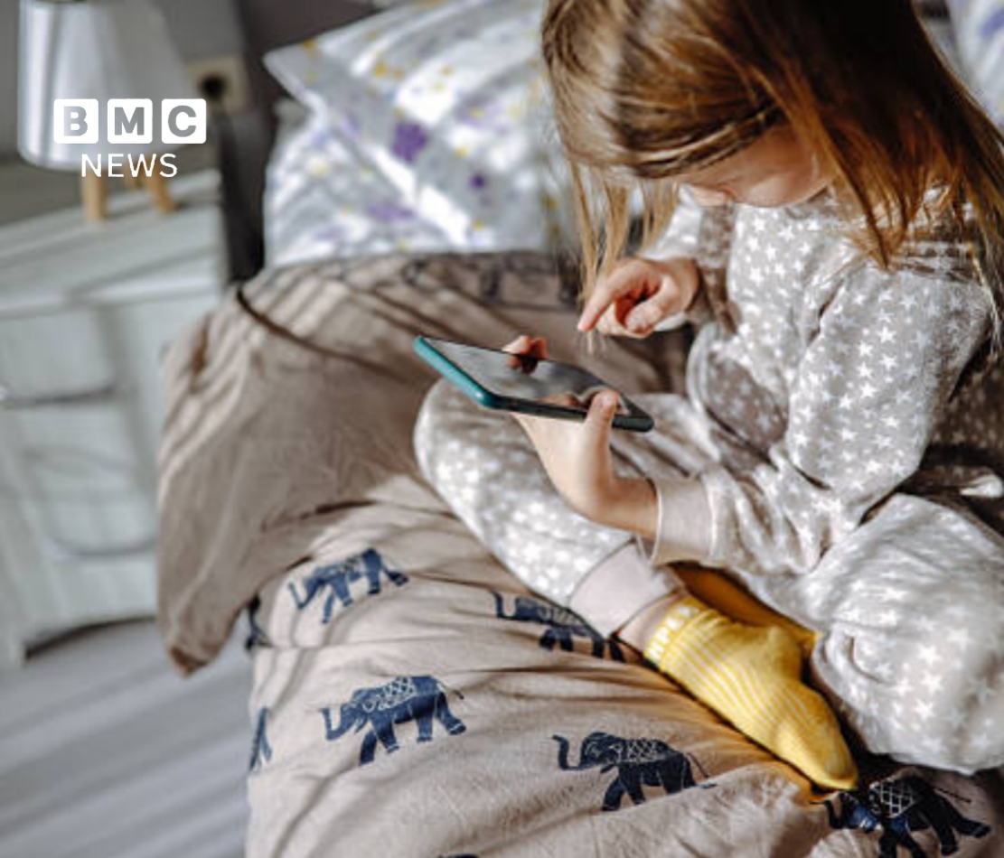 French teenager using a smartphone, illustrating France's new social media ban under 15